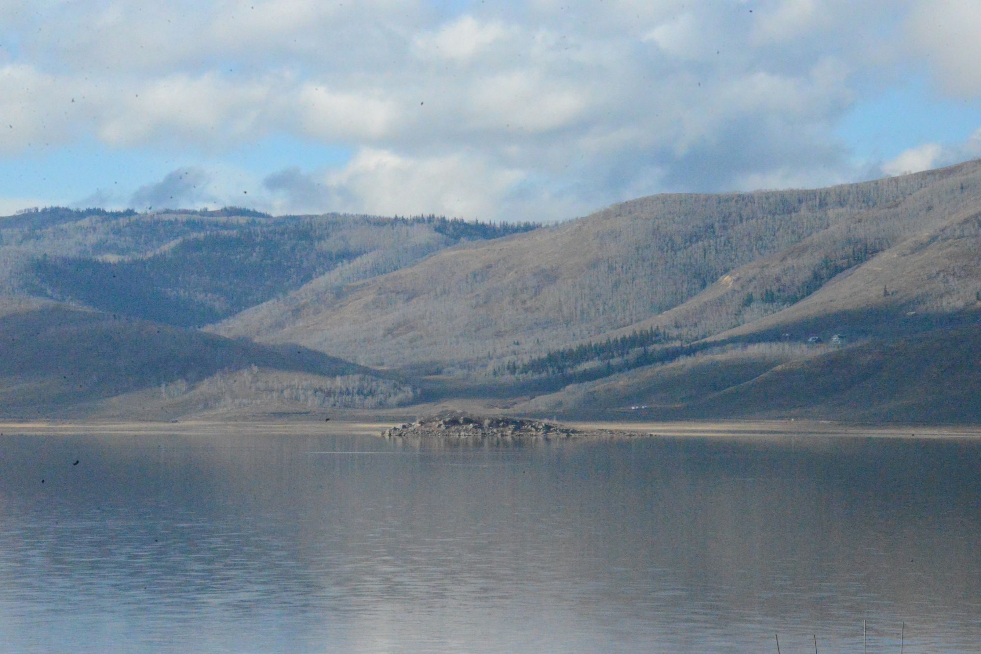 Forested mountains rising above the reservoir