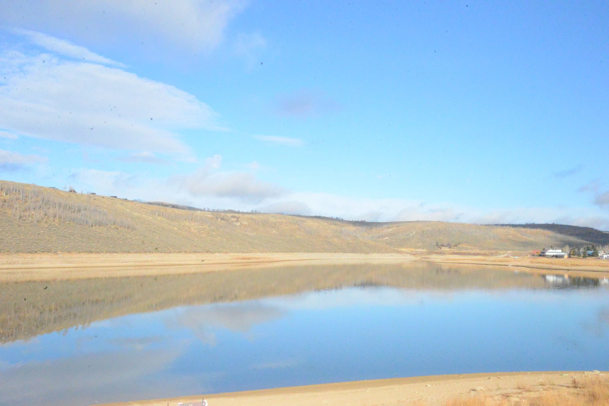 Calm reservoir reflecting the sky