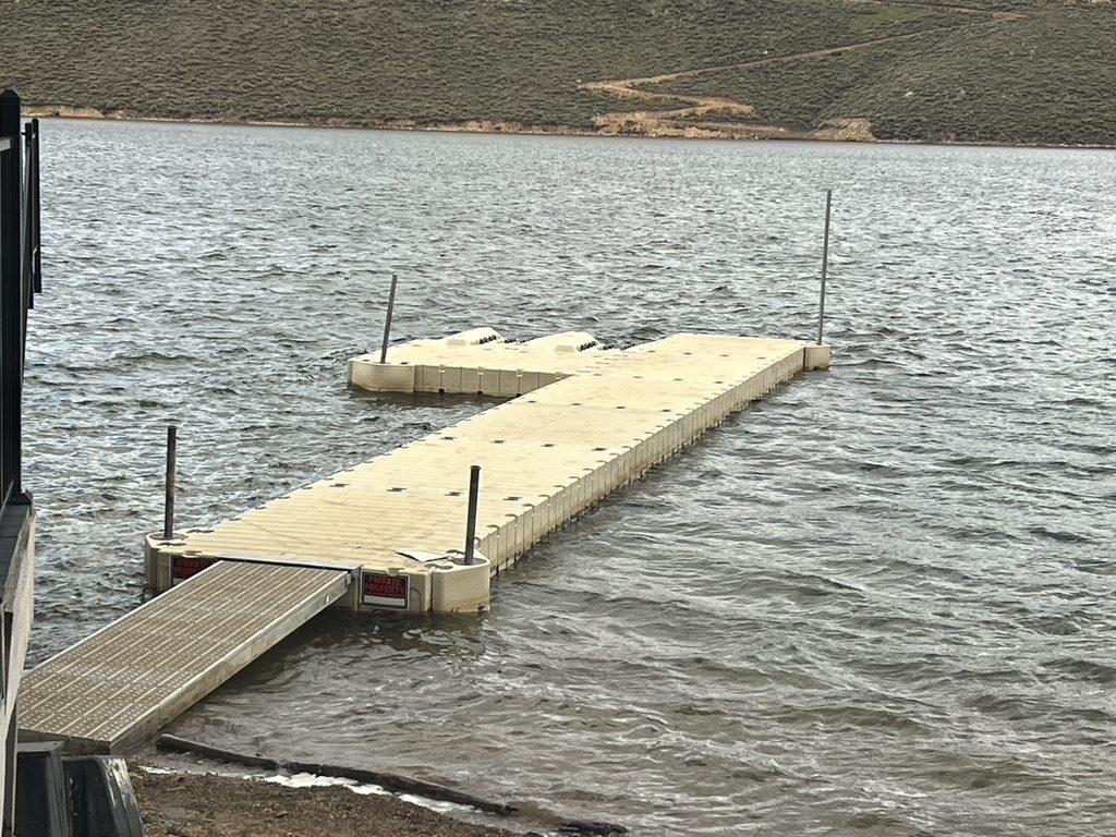 The private floating dock stretching out into the reservoir