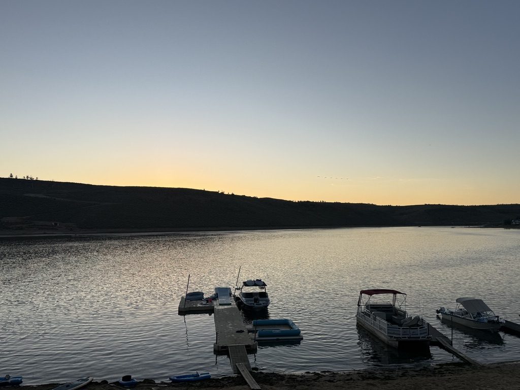 Boats tied up at the docks on a calm evening on Scofield Reservoir